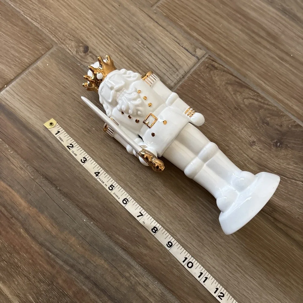 White Porcelain Nutcracker with Gold Trim Form The Holiday Aisle Figurine